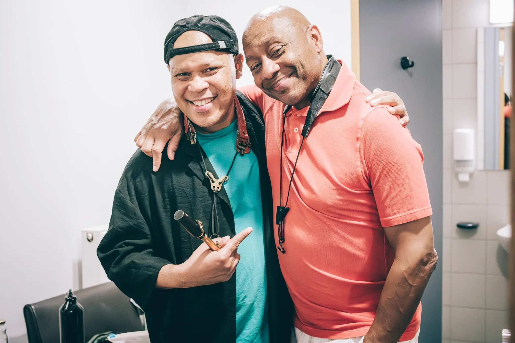 Steve Coleman and Branford Marsalis smiling with their arms around each other in Ghent.